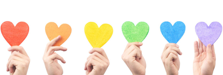 Hearts in a rainbow of colors symbolizing mental healthcare for the LGBTQ+ population