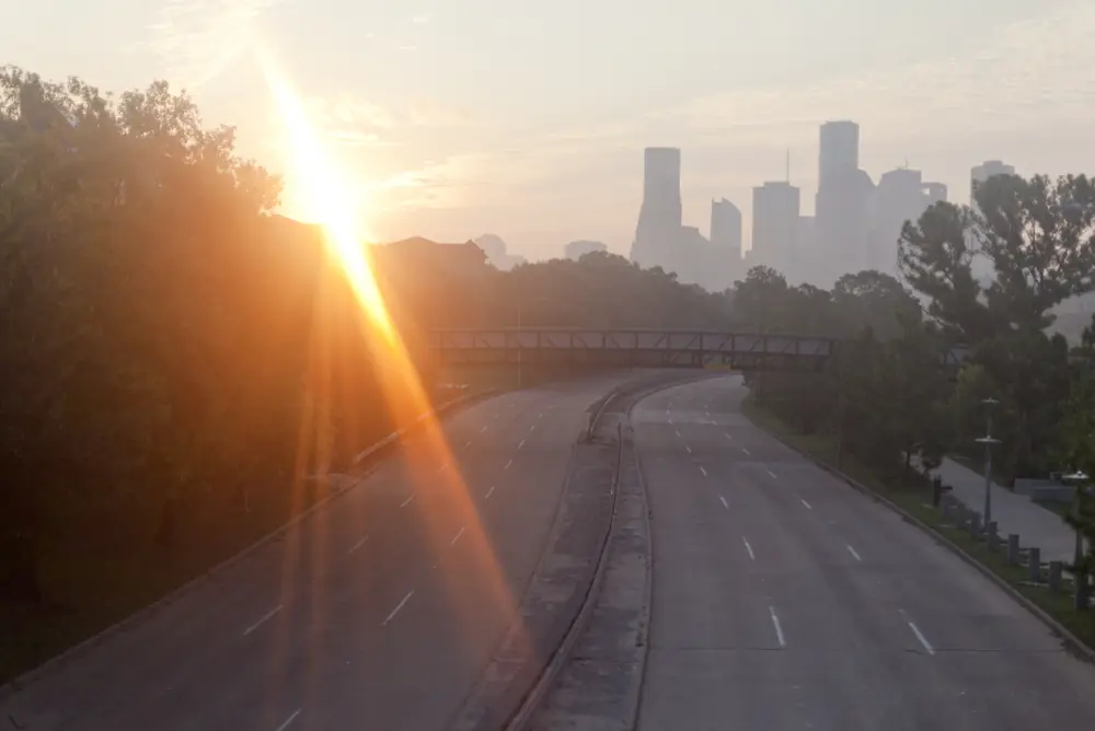 Sun rising over the city skyline in Houston, Texas with empty streets